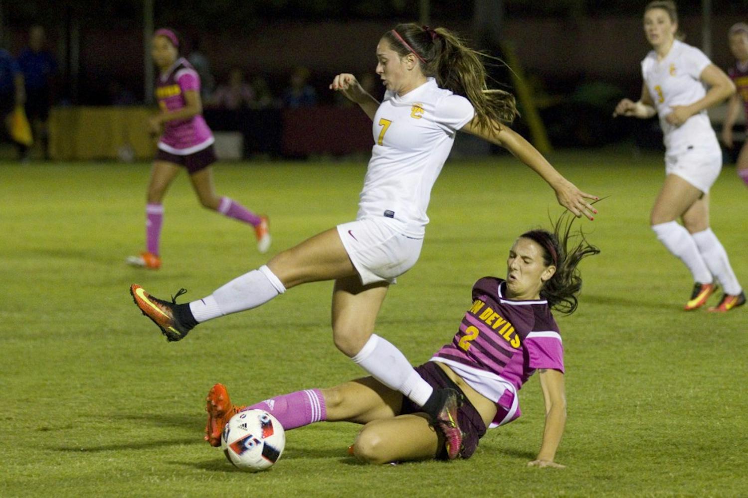 ASU freshman forward Christina Edwards (2) executes a slide tackle in the second half of a 2-0 loss to the USC Trojans in Sun Devil Soccer Stadium in Tempe, Arizona, on Saturday, Oct. 15, 2016. The team wore pink uniforms for their annual game dedicated to Breast Cancer Awareness. 