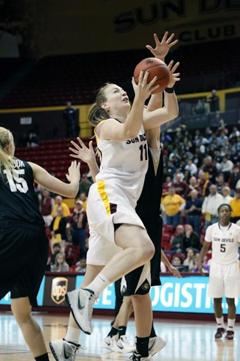 Kali Bennett drives to the hoop against Colorado on Jan. 19. Bennett tied a school record for seven blocks in a game as ASU defeated Utah 59–51 on Saturday. (Photo by Beth Easterbrook)