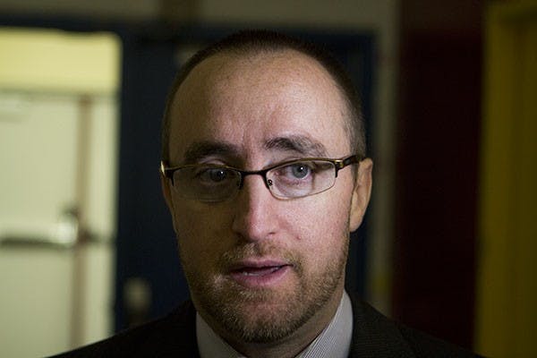 Coach Greg Powers speaks to the media about the hockey team’s win over Delaware. (Photo by Dominic Valente)