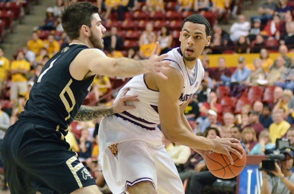 Trent Lockett looks to pass around a defender in a game against Colorado on Feb. 11. Lockett and the Sun Devils will focus on playing as a cohesive team when they travel to Washington. (Photo by Aaron Lavinsky)