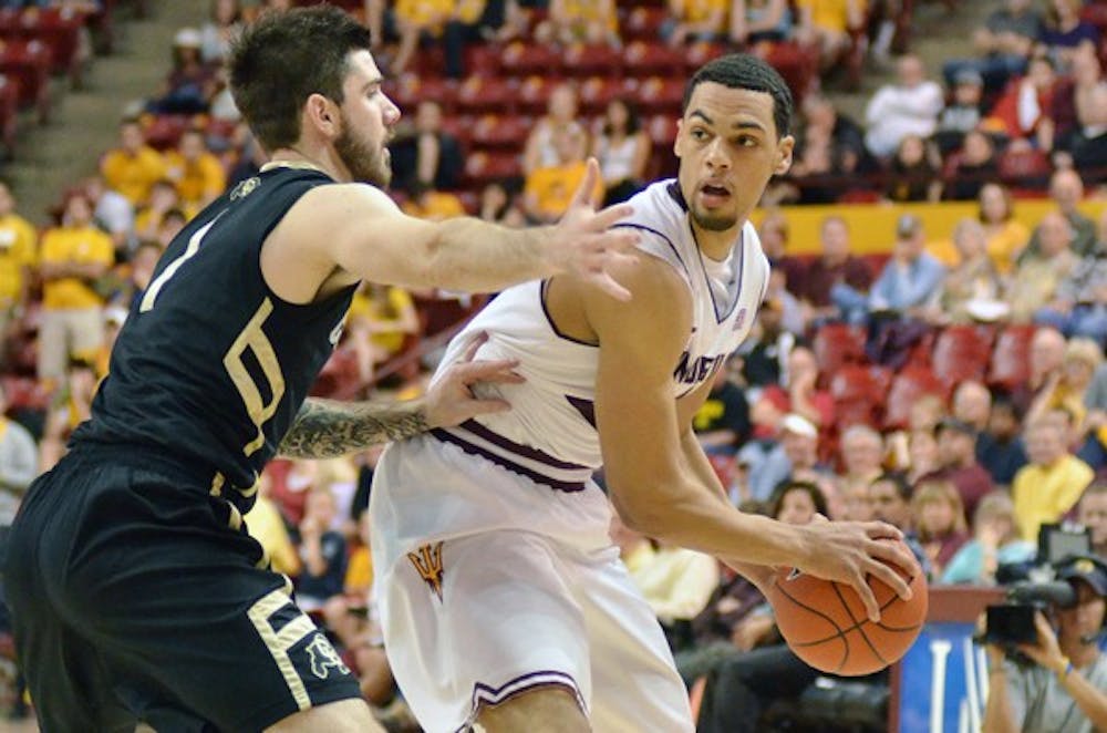 Trent Lockett looks to pass around a defender in a game against Colorado on Feb. 11. Lockett and the Sun Devils will focus on playing as a cohesive team when they travel to Washington. (Photo by Aaron Lavinsky)