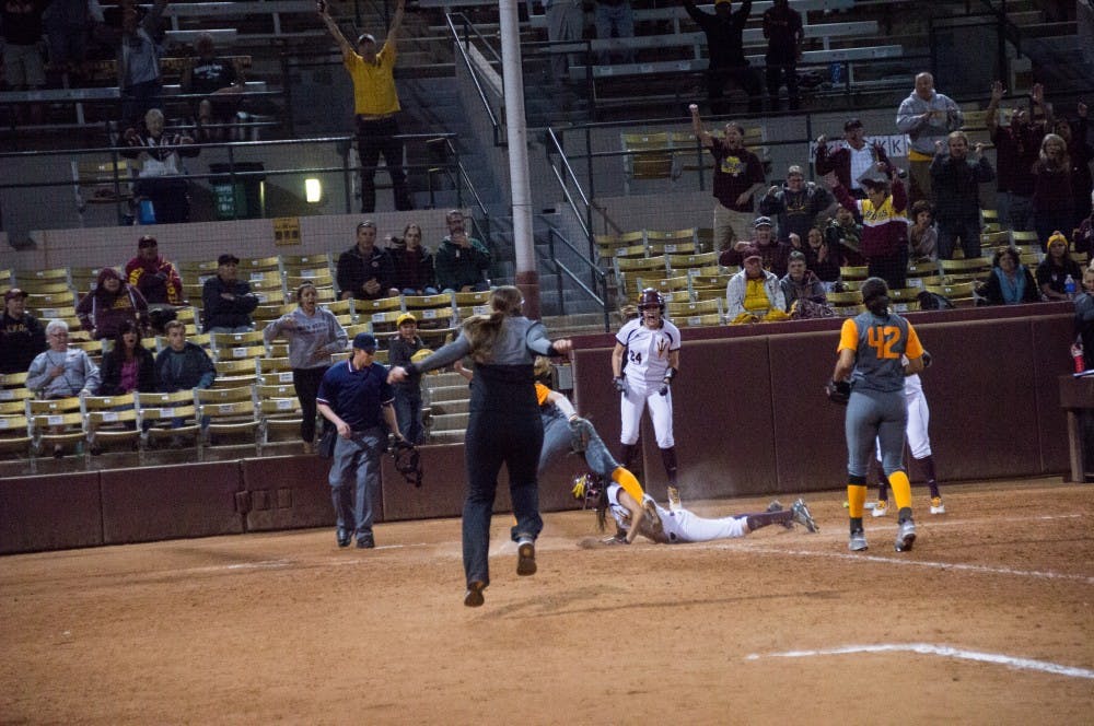 Senior outfielder Jennifer Soria slides into homebase for the winning run.