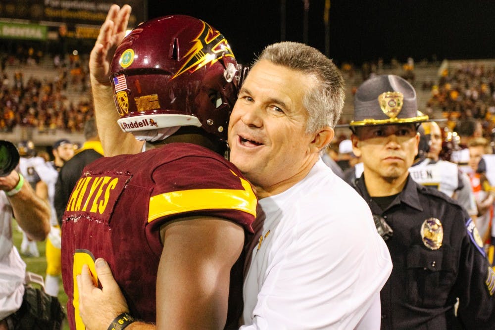 Todd Graham, ASU head football coach, congratulates player "Gump" Hayes (8) after the football game versus the California Golden Bears in Tempe, Arizona, on Saturday, Sept. 24, 2016.