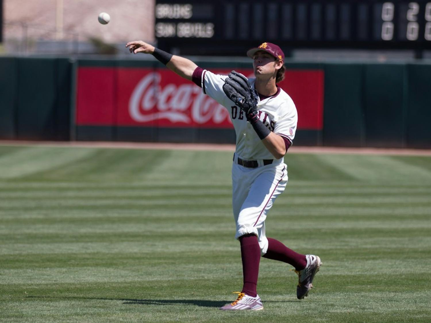 ASU junior infielder Andrew Snow (4) catches the relay and throws the ball to the plate during game three of a baseball series against the UCLA Bruins at Phoenix Municipal Stadium in Phoenix on April 2, 2017.