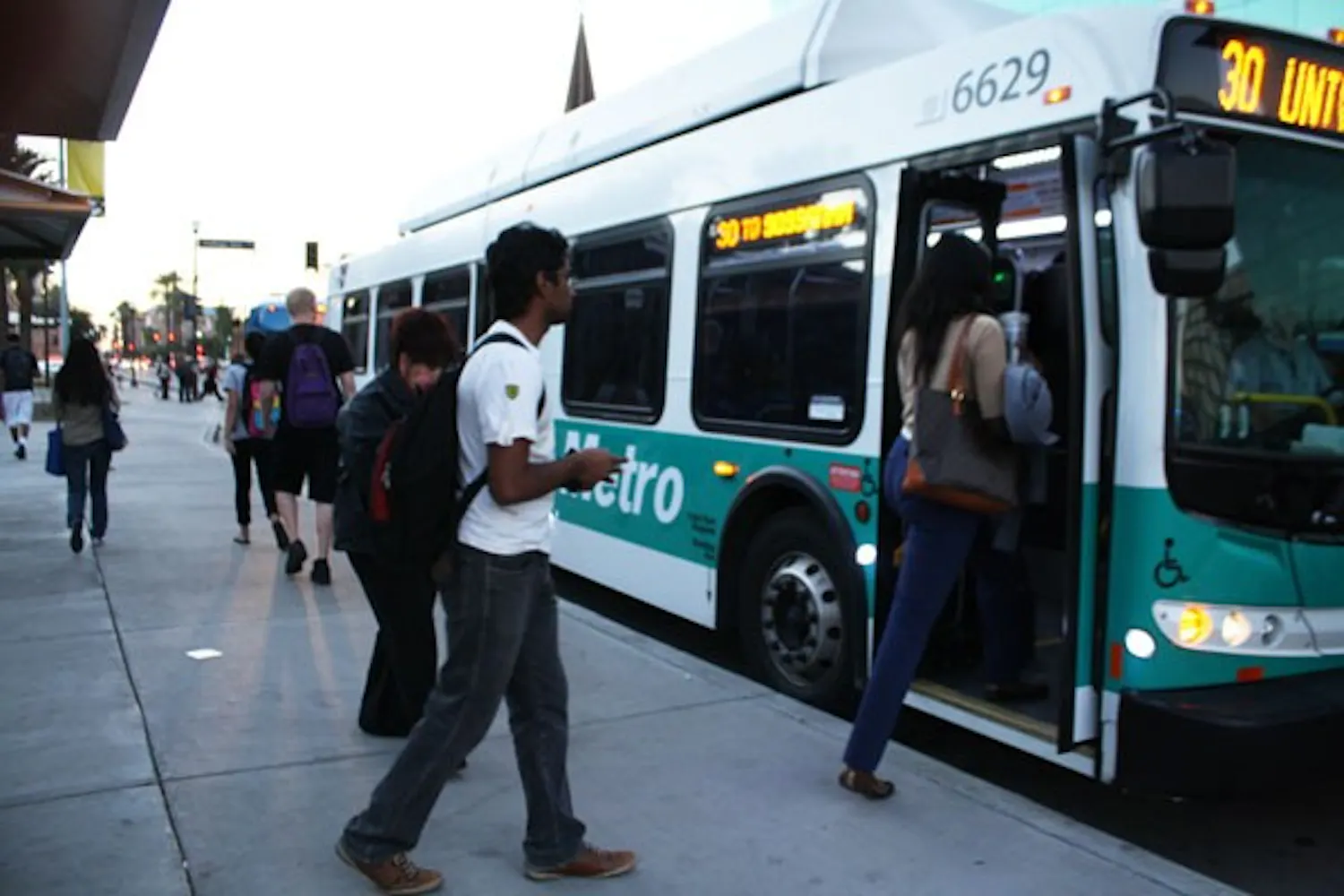 The City of Tempe is looking to save money by contracting with Valley Metro to run its bus system, which includes the Orbit and Flash buses. (Photo by Jessie Wardarski)