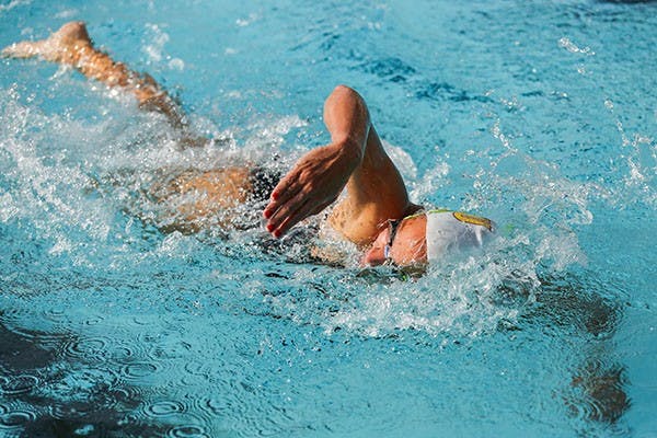 Senior Tristan Baxter swims during women's 1000 yard freestyle. The match was held at Mona Plummer Aquatic Center Friday, Nov. 8th. (Photo by Arianna Grainey)