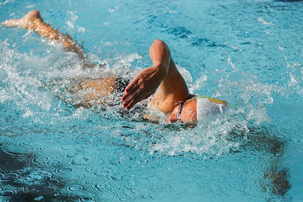 Senior Tristan Baxter swims during women's 1000 yard freestyle. The match was held at Mona Plummer Aquatic Center Friday, Nov. 8th. (Photo by Arianna Grainey)