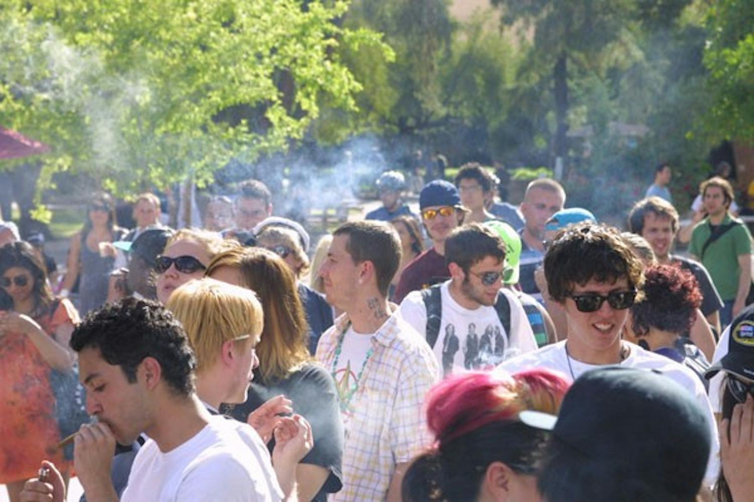 JOINT EFFORT: A haze of smoke rises above hundreds gathered to celebrate 4/20 with imitation marijuana in front of the Memorial Union Tuesday afternoon. (Photo by Serwaa Adu-Tutu)