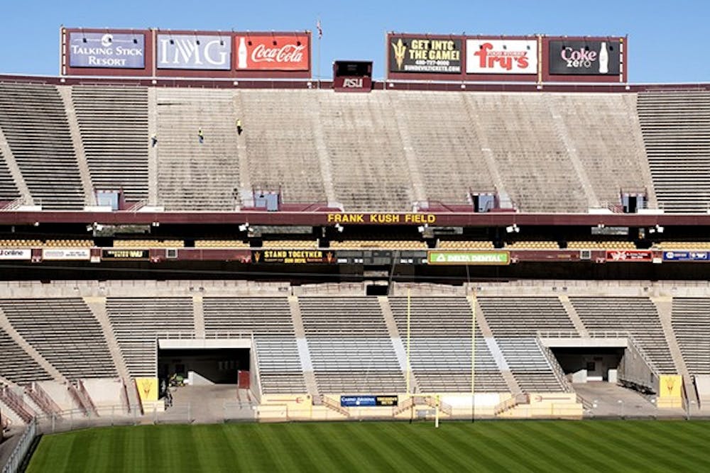 ASU workers are removing the North end section of seats of Sun Devil Stadium on Wednesday, Jan. 15. (Photo by Mario Mendez)