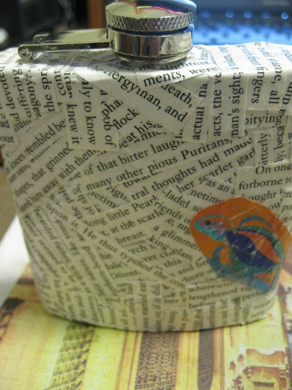 A flask made by Faith Breisblatt using words from the novel The Scarlet Letter.