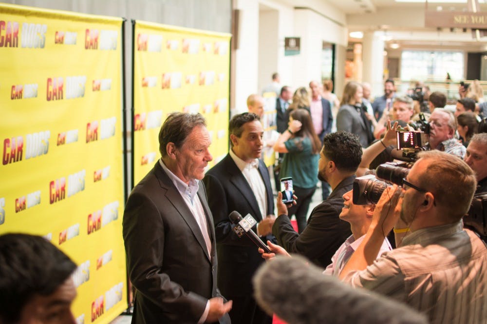Car Dogs Actor Chris Mulkey, left, and Director Adam Collis, right, speak to journalists on the red carpet during the movie’s premiere Monday, March 20, 2017 at Harkins Camelview at Scottsdale Fashion Square. 