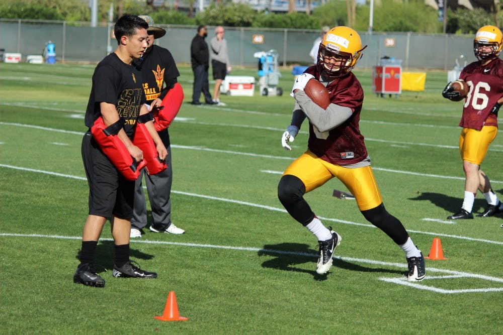 Junior running back D.J. Foster participates in drills at ASU football's first spring practice on March 18 at the Kajikawa Football Practice Fields in Tempe. (Photo by Evan Webeck)