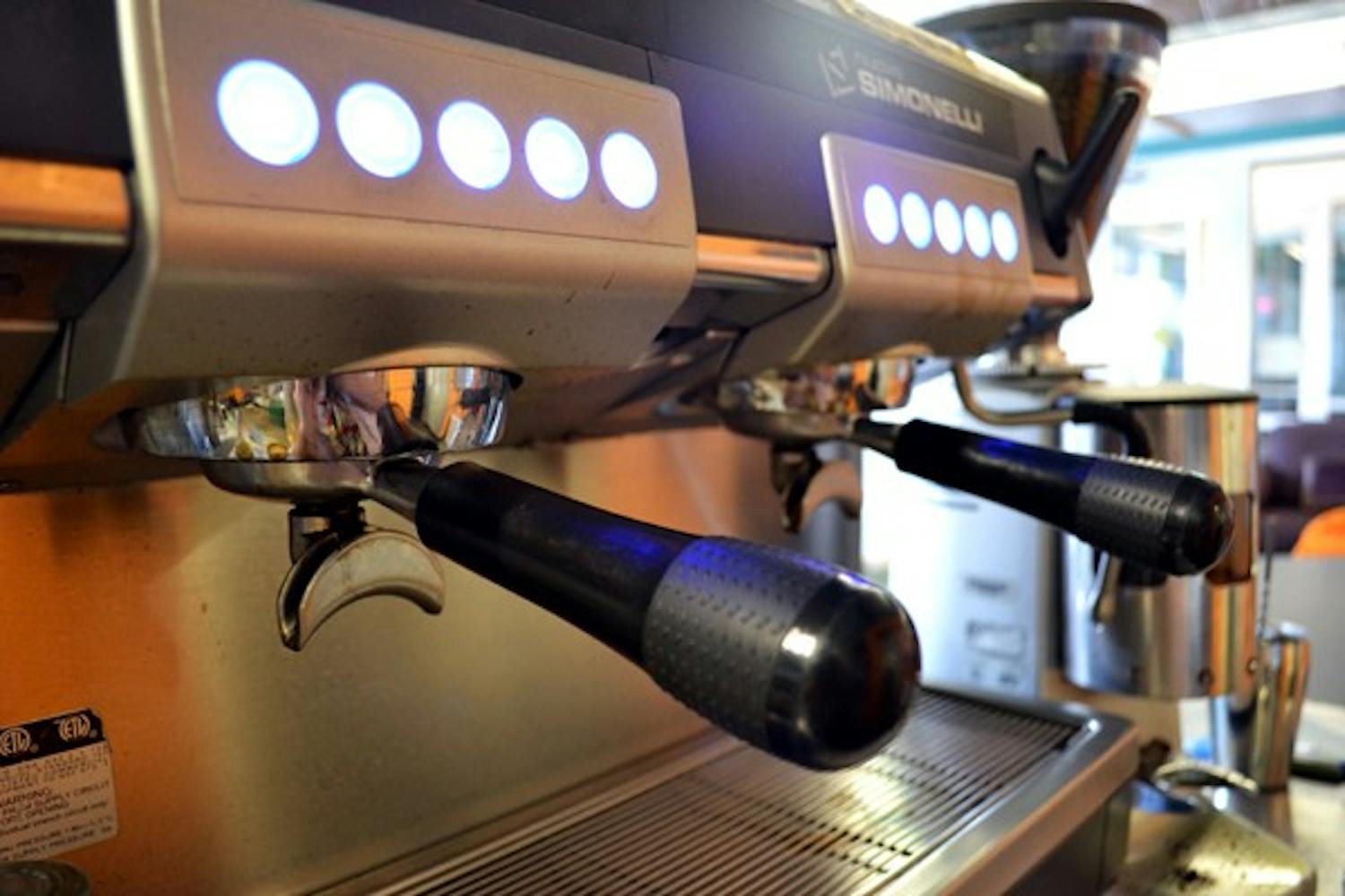 An espresso machine at the Fair Trade Cafe provides fuel to students on the Downtown campus Monday morning. (Photo by Brittany Lea)