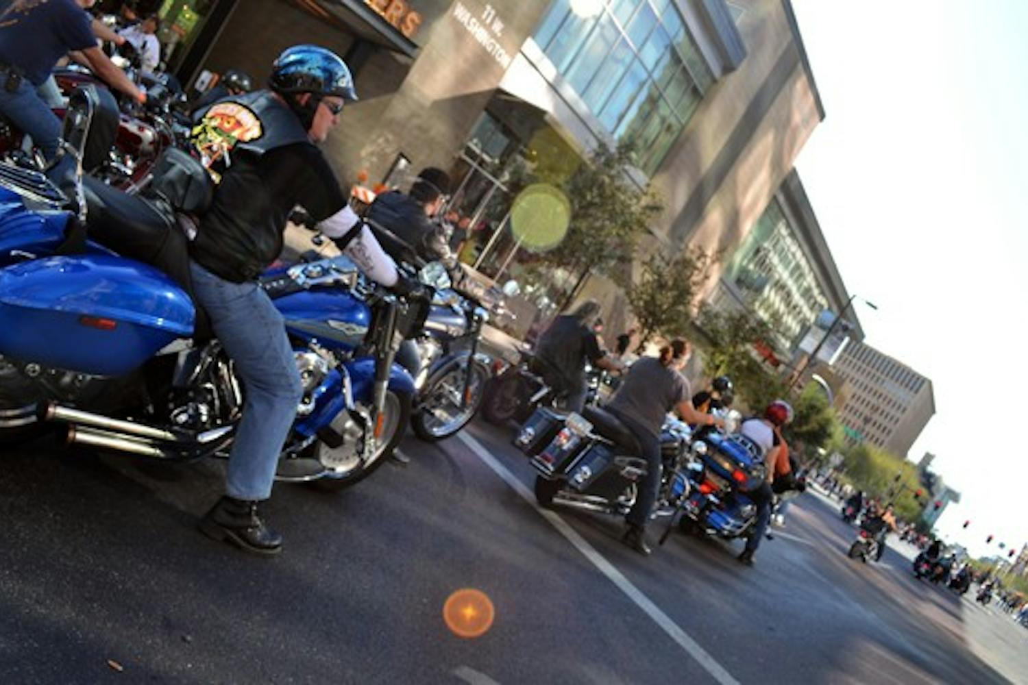 Motorcyclists stop at a light blocks away from the finish line of the Arizona Centennial Ride Saturday afternoon in downtown Phoenix. (Photo by Brittany Lea)