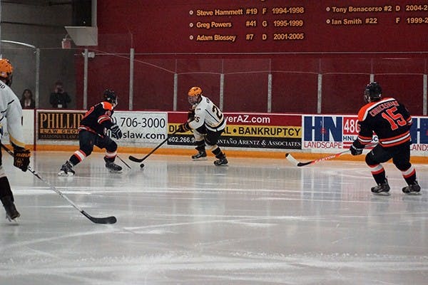 ASU senior forward Liam Norris attempts to get past William Nunez of Illinois during the second quarter at Oceanside Arena in Tempe on Nov. 21, 2014. ASU won against Illinois 2-1. (Photo by Stephanie Specht)