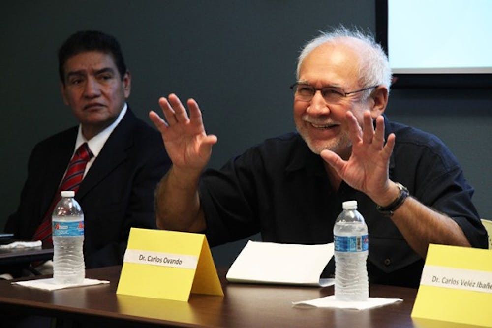 ACROSS BORDERS: ASU professor Dr. Carlos Ovando speaks to a group of faculty and students from the school of Transborder Studies Monday morning about retornos, or those who have returned to Mexico by order of immigration law. (Photo by Rosie Gochnour)