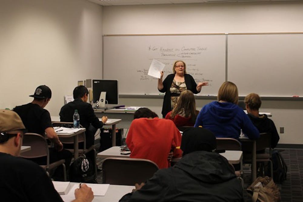 Communications Professor Diana Hutchinson lectures her class. According to John Kavanaugh's bill, she could report one of her students if she has reasonable suspicion that the student is dangerous.  (Photo by Laura Davis)