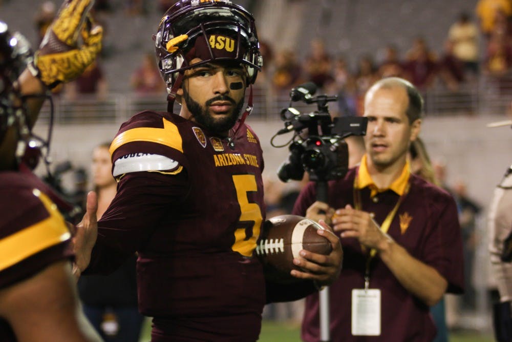 ASU Sun Devils quarterback Manny Wilkins (5) celebrates with teammates after a victory against the California Golden Bears in Sun Devil Stadium in Tempe, Arizona, on Saturday, Sept. 24, 2016.