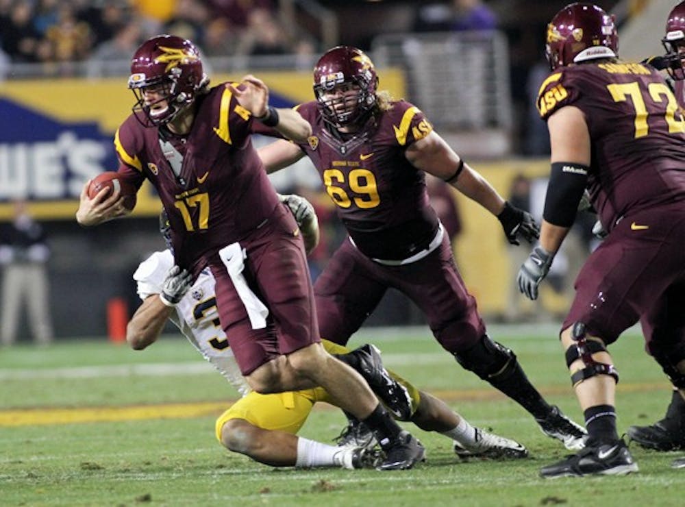 California senior linebacker D.J. Holt takes down ASU junior quarterback Brock Osweiler during the Golden Bears 47-38 win over the Sun Devils on Friday. After starting the season at 6-2, the Sun Devils lost their final four games to close out the regular season. (Photo by Lisa Bartoli)
