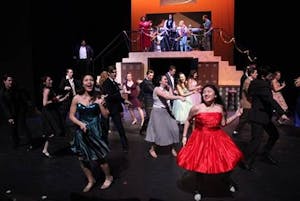 Actors perform a scene from Grease.&nbsp;