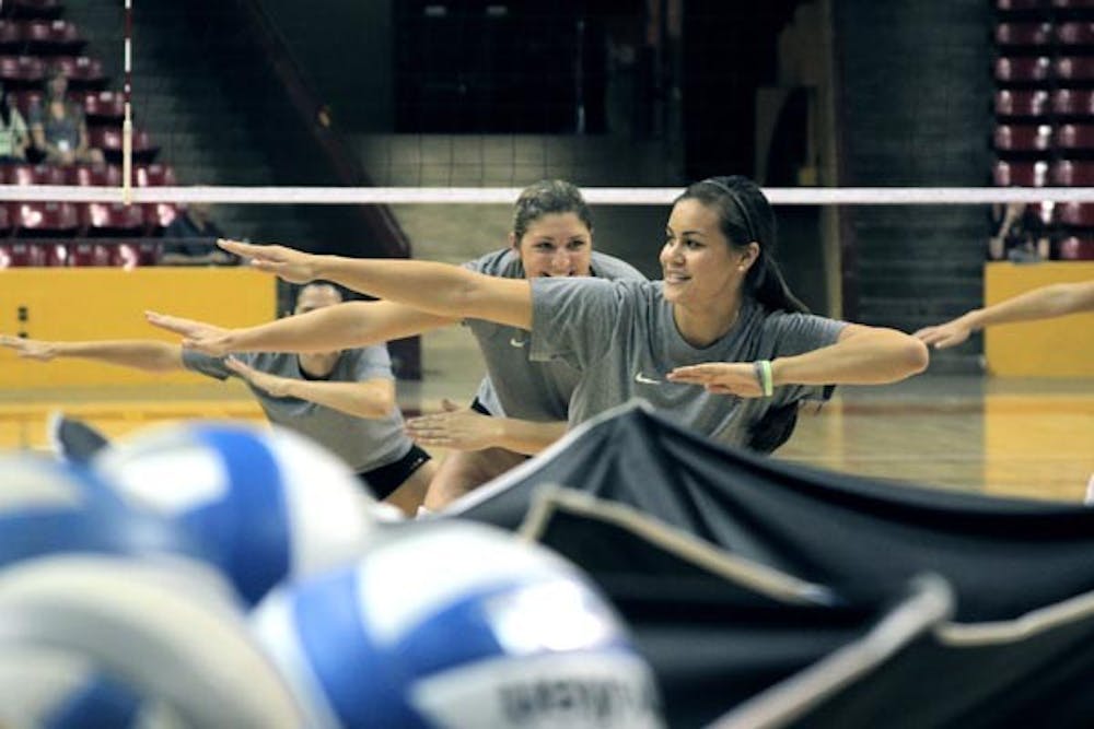 BACK IN ACTION: ASU volleyball sophomores Malia Marquardt (front) and Sonja Markanovich get loose during practice in preparation for the new season. (Photo by Andy Jeffreys)