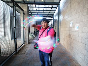 Digital culture sophomore Marco Castillo shows off his LED gloves on Monday, Nov. 23, 2015, on the Tempe campus.