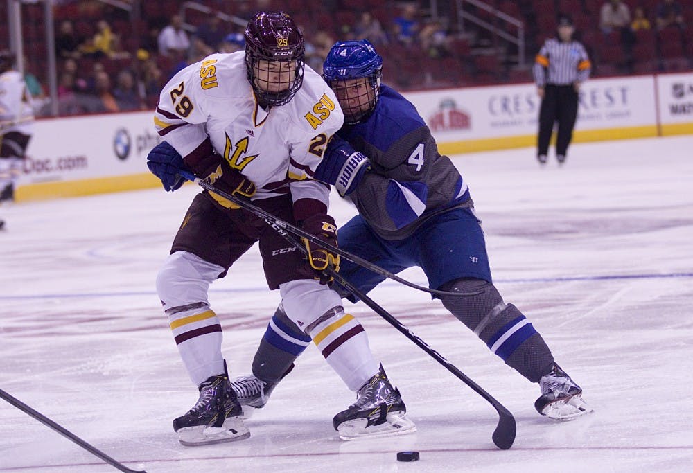 ASU freshman left defender Jakob Stridsberg (29) holds off Air Force defender Phil Boje in the first period of a 5-2 victory against Air Force in Gila River Arena in Glendale, Arizona, on Sunday, Oct. 16, 2016.