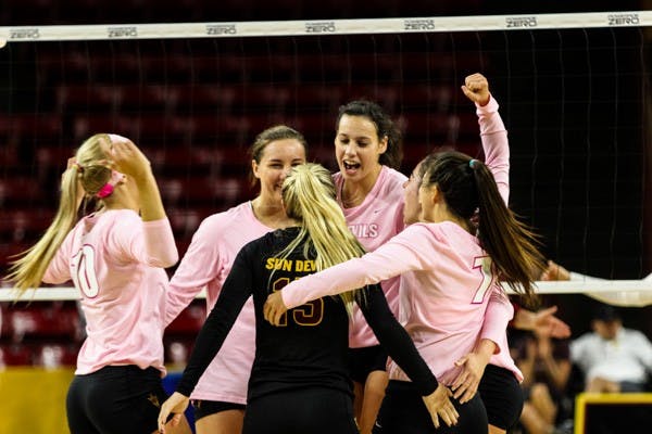 Junior middle blocker Whitney Follete celebrates after the Devils force a game point in the third set during the match vs Washington State on Sunday, Oct. 19th, 2014, at Wells Fargo Arena in Tempe. The Sun Devils would rally from two sets down to beat the Cougars 3-2. (Photo by Daniel Kwon)
