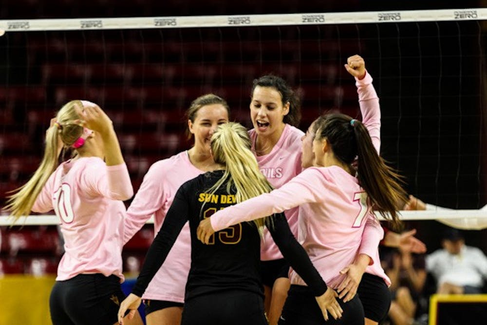 Junior middle blocker Whitney Follete celebrates after the Devils force a game point in the third set during the match vs Washington State on Sunday, Oct. 19th, 2014, at Wells Fargo Arena in Tempe. The Sun Devils would rally from two sets down to beat the Cougars 3-2. (Photo by Daniel Kwon)