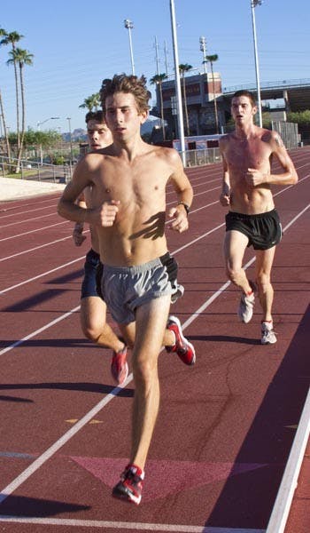 FLEET FEET: Sophomore Doug Smith runs on the track at Sun Angel Stadium during practice earlier this season. The men's team split between South Bend, Ind. and Mesa this weekend. (Photo by Annie Wechter)