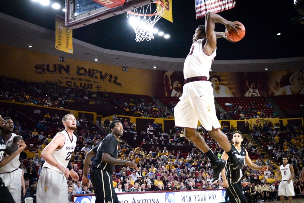 Senior Shaquielle McKissic slams the ball for two points in the second half against Colorado on Saturday, Jan. 17, 2015 at Wells Fargo Arena in Tempe. The Sun Devils went on to with against the Buffalos 78-72. (J. Bauer-Leffler/The State Press)