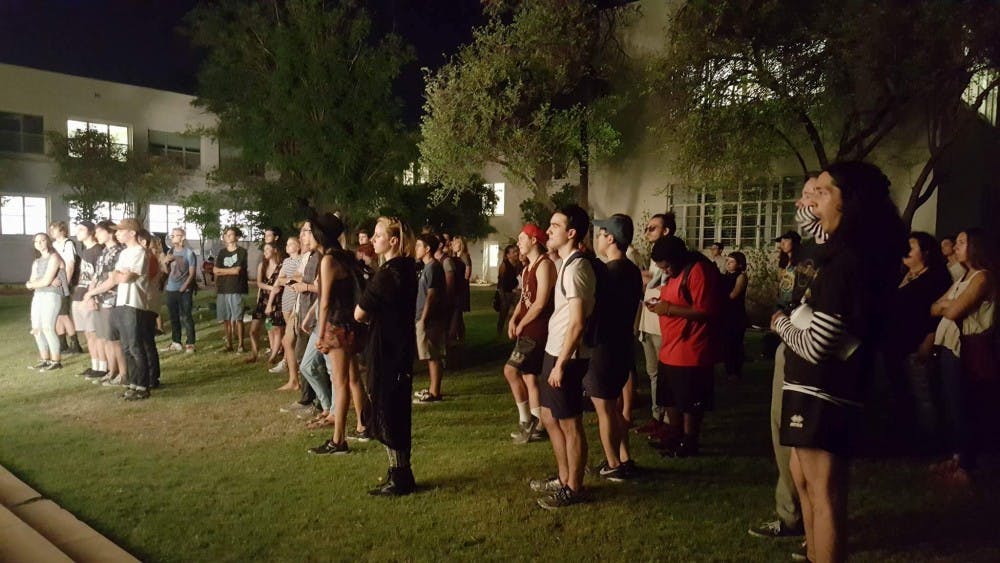 Students watch the Underground Foundation&nbsp;performance in the Tempe Secret Garden on Thursday, August 25.&nbsp;