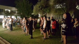 Students watch the Underground Foundation&nbsp;performance in the Tempe Secret Garden on Thursday, August 25.&nbsp;