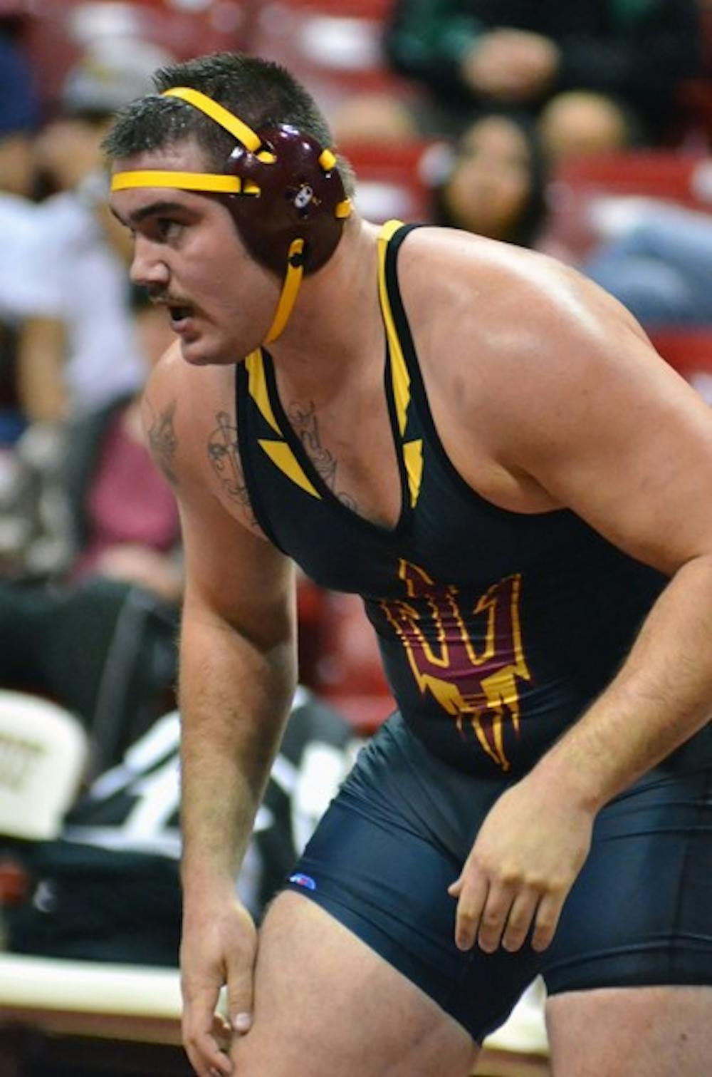 ASU redshirt junior heavyweight Levi Cooper stares down his opponent during the Sun Devils’ meet against GCU and Embry-Riddle on Nov. 13. Cooper was the only wrestler to place for the Sun Devils in the Cliff Keen Las Vegas Invitational over the weekend. (Photo by Aaron Lavinsky)