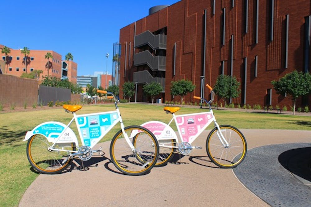 The FreeProject bikes, sponsored by Lyft, sit outside the BAC building on Tempe Campus. (Photo by Micaela Rodriguez)
