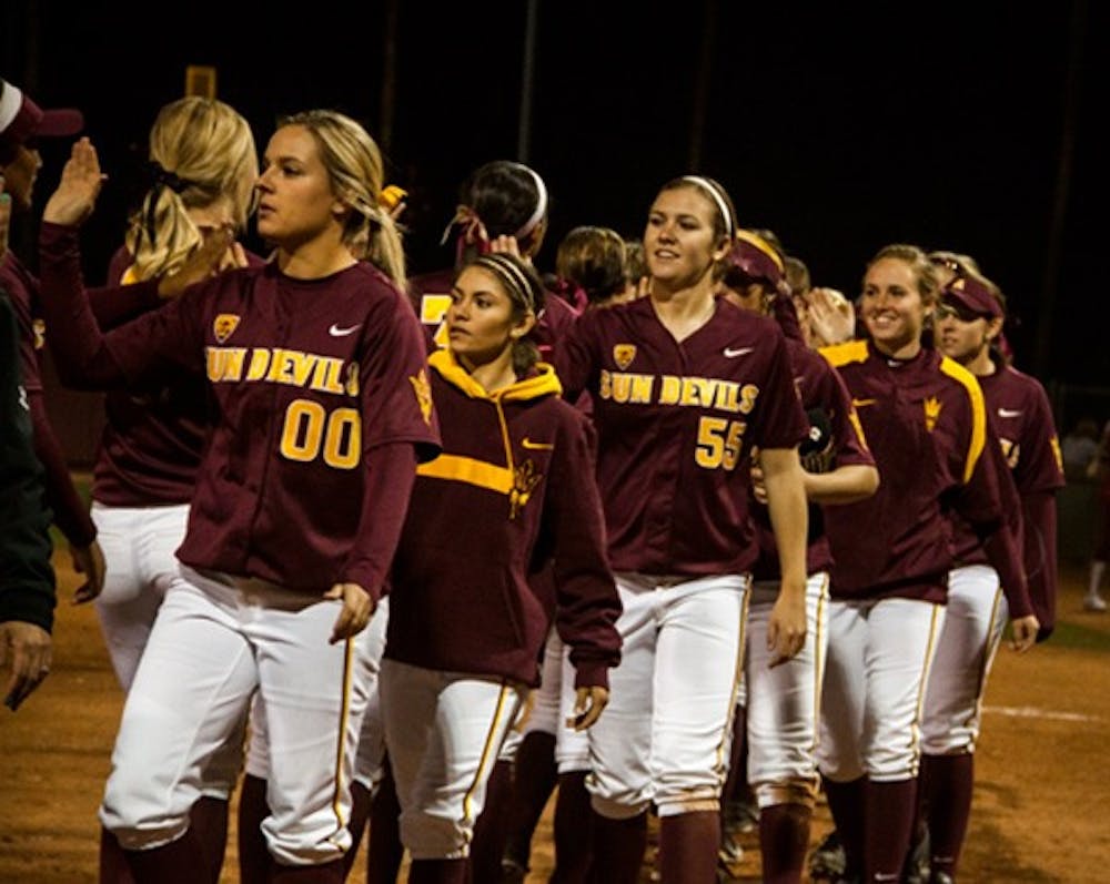 Redshirt freshman pitcher Jenna Makis leads the ASU softball team in a high line after the team won both games of a double-header on Feb. 9. (Photo by Abhiram Chandrash)