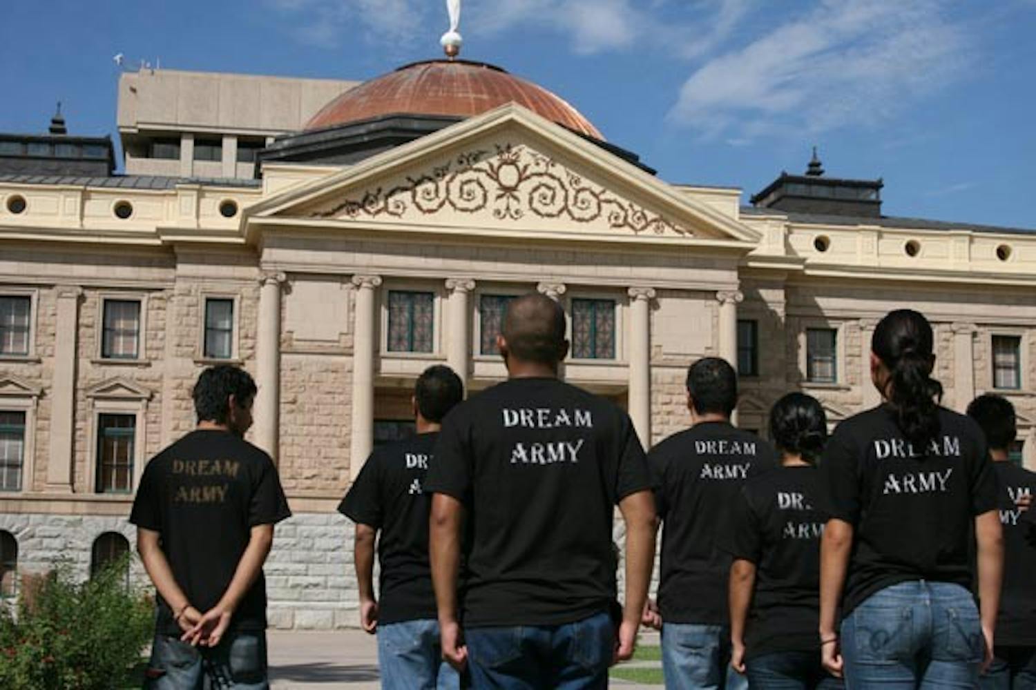 DREAM ARMY: Former JROTC students stand in front of the State Capitol building Tuesday performing military drills in connection to the Dream Act. (Photo by Anthony Sandoval)
