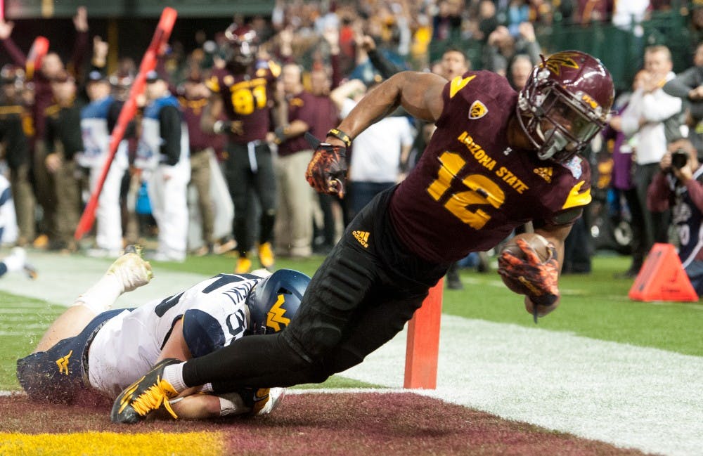 Redshirt junior wide receiver Tim White (12) scores a touchdown against West Virginia during the Motel 6 Cactus Bowl on Saturday, Jan. 2, 2016, at Chase Field in Phoenix.