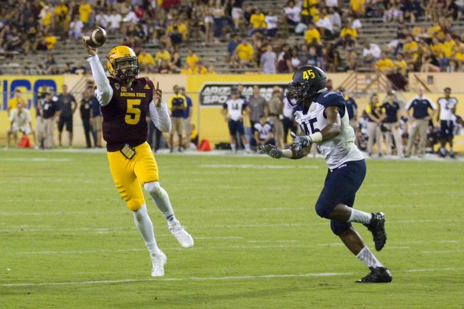 Arizona State redshirt sophomore quarterback Manny Wilkins looks to pass for a touchdown during the 44-13 victory against the Northern Arizona University Lumberjacks in Sun Devil Stadium in Tempe, Arizona, on Saturday, September 3, 2016.