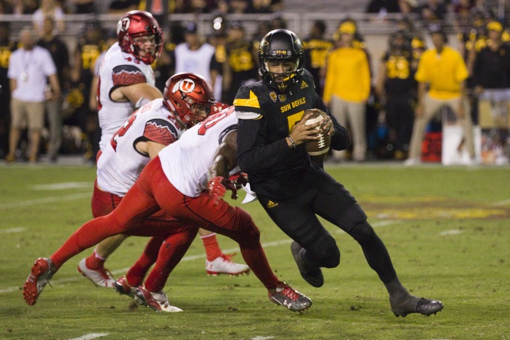 ASU redshirt sophomore quarterback Manny Wilkins (5) evades a sack in the second half of a 49-26 loss to the Utah Utes in Sun Devil Stadium in Tempe, Arizona, on Thursday, Nov. 10, 2016. Wilkins was sacked eight total times in the game. 