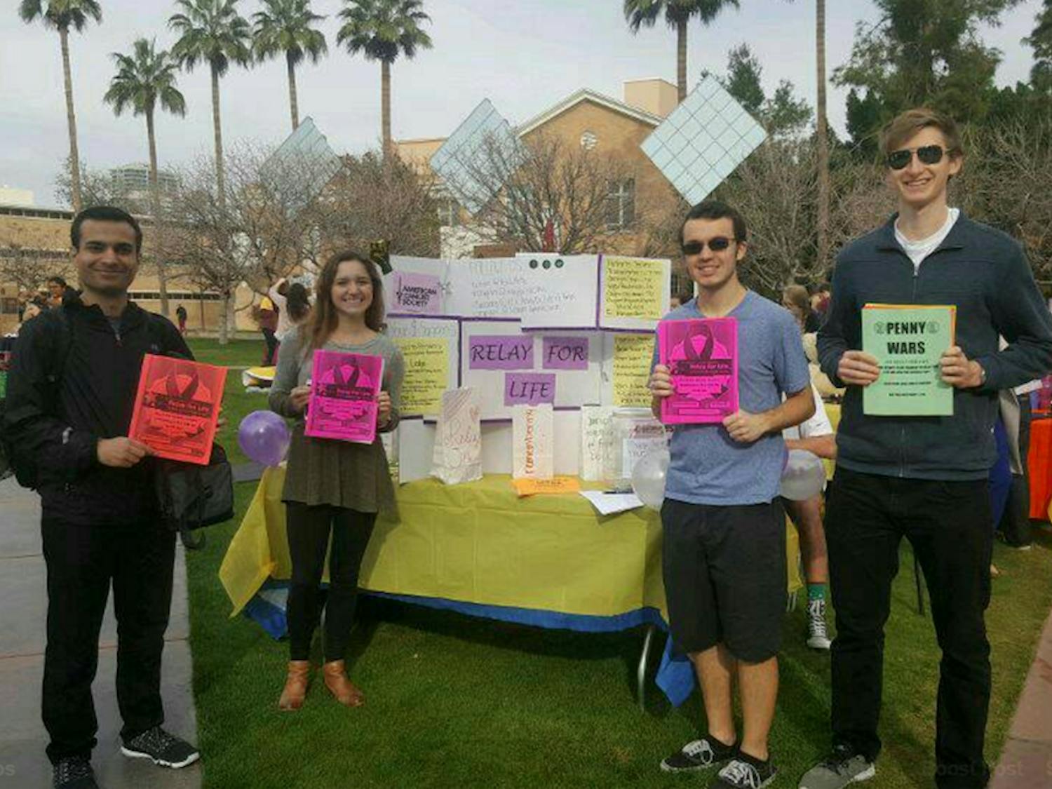 Students pose for a photo at a tabling event for Relay for Life on Hayden lawn at ASU's Tempe campus in 2017.
