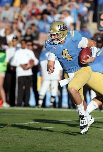 UCLA quarterback Kevin Prince runs the ball during the first half of UCLA's upset win over ASU on Saturday. Prince's steady performance was a huge factor in the victory. (Photo by Beth Easterbrook)