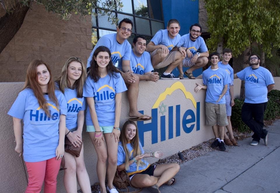 Students pose for a photo&nbsp;outside of Hillel together.