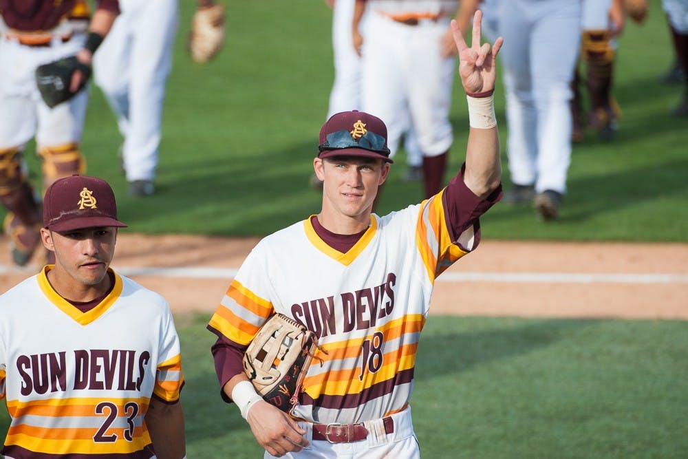 Junior center fielder Johnny Sewald salutes fans after the Sun Devils defeated Clemson 7-4 on Friday, May 29, 2015, at Goodwin Field in Fullerton, California.