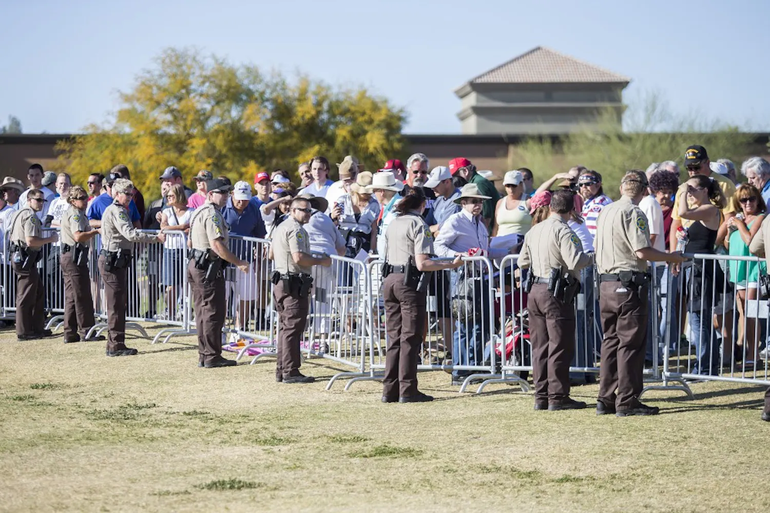 Security personnel patrol a rally for presidential candidate Donald Trump at Fountain Park in Fountain Hills, Arizona, on Saturday, March 19, 2016.