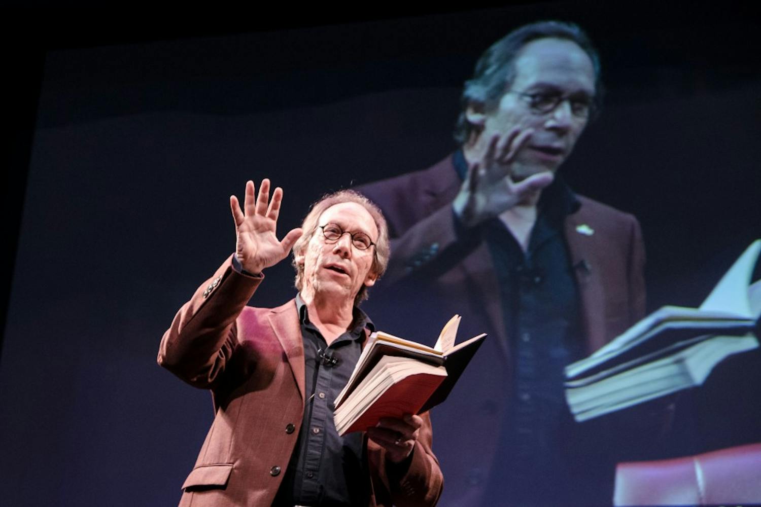 Lawrence Krauss, founder of the ASU School of Earth and Space Exploration, speaks at an Origin Projects event at the Orpheum Theater on Oct. 19, 2016. The ASU Origins Projects brings together experts to publicly discuss a wide range of cultural and scientific topics.