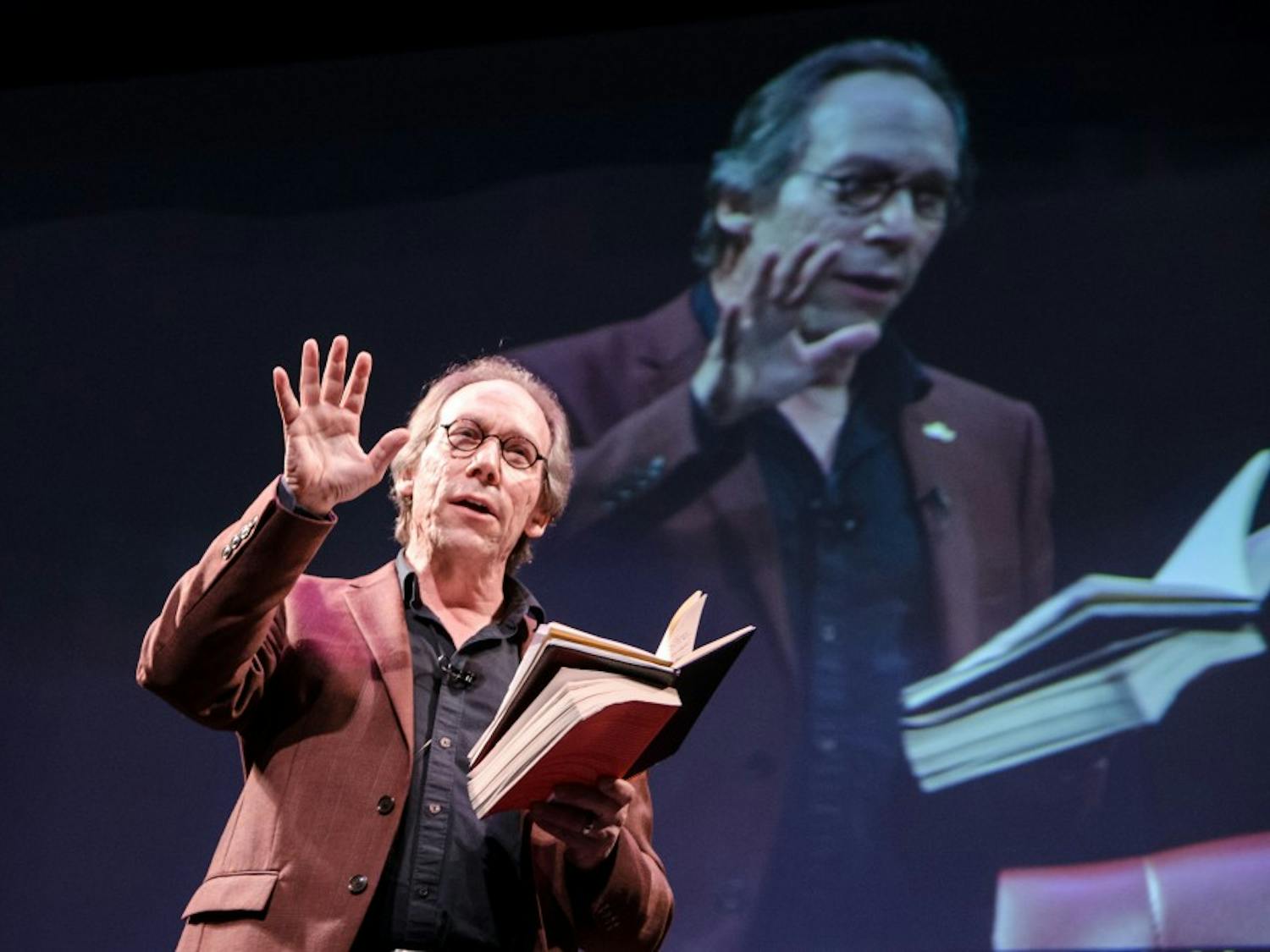 Lawrence Krauss, founder of the ASU School of Earth and Space Exploration, speaks at an Origin Projects event at the Orpheum Theater on Oct. 19, 2016. The ASU Origins Projects brings together experts to publicly discuss a wide range of cultural and scientific topics.