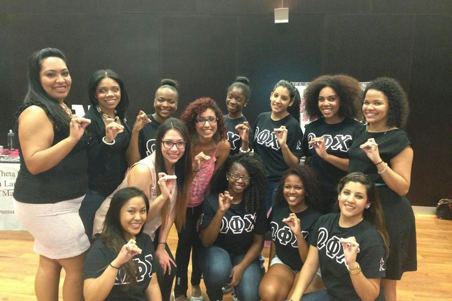 Members of&nbsp;Omega Phi Chi at the&nbsp;Multicultural Open House on Aug. 29, 2013.&nbsp;