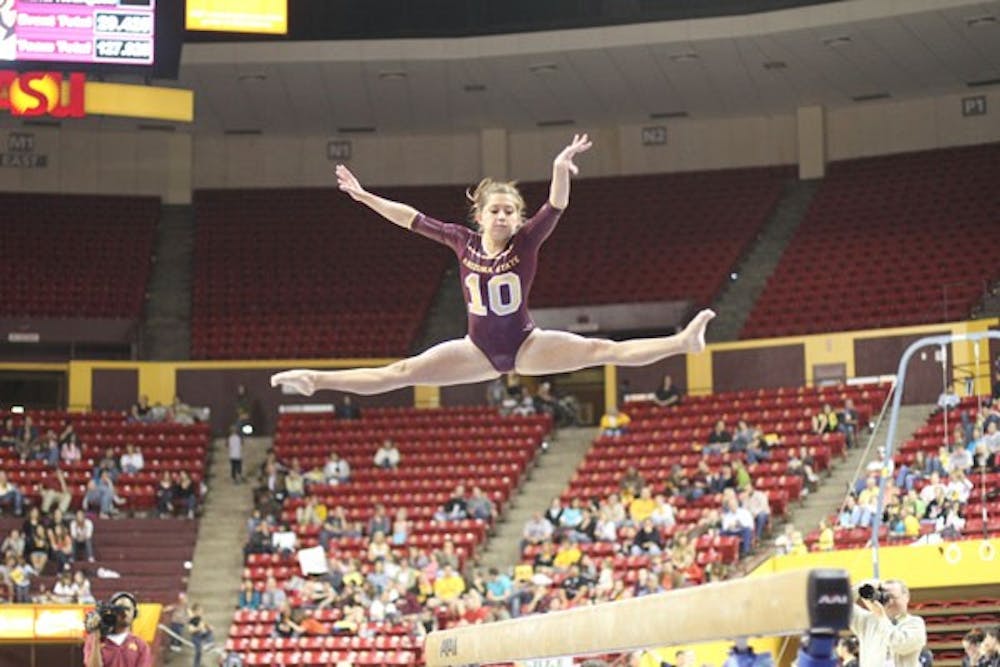 PERFECT FORM: ASU sophomore Kahoku Palafox performs her balance beam routine during the Sun Devils’ meet against Oregon State last week at Wells Fargo Arena. (Photo by Nikolai de Vera)