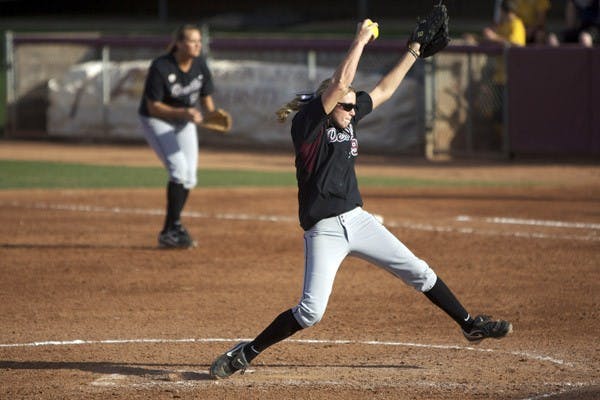 PAINTING POTENTIAL: Open Source Project owner Michael Witham admires the artwork of local artist Lalo Cota in his new business that will offer coffee, ideas and good times. (Photo by Rosie Gochnour)